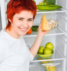 Obraz premium woman against the refrigerator