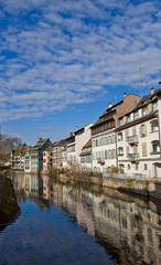 Fototapeta na wymiar Historic houses on quay of Ill river. Strasbourg, France