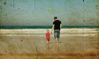 father and daughter on the beach. Photo in old image style.