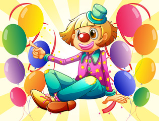 Obraz na płótnie Canvas Kobiet clown siedzi w środku balonów