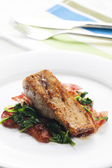 tilapia fillet with warm spinach and bacon salad