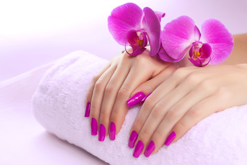 beautyful manicure with fragrant orchid and towel.