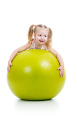 Fototapeta na wymiar Child having fun with gymnastic ball isolated