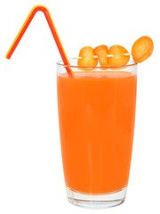 Glass of carrot juice decorated sliced carrots.