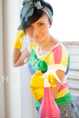 Woman holding windows cleanser