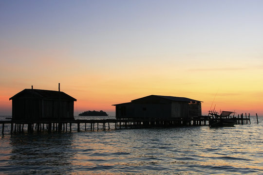 Silhouette of wooden jetty at sunrise, Koh Rong island, Cambodia