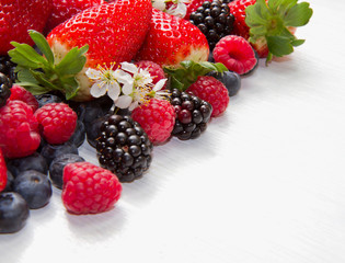Berries on white Wooden Background