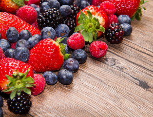 Berries on Wooden Background