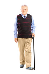 Full length portrait of a senior man walking with a cane