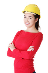 Portrait of confident female worker in helmet.