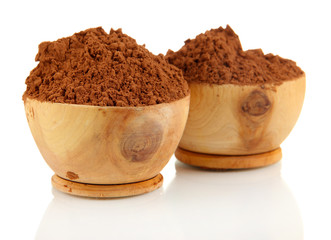 Cocoa powder in wooden bowls, isolated on white