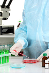 Scientist conducting research in laboratory close up