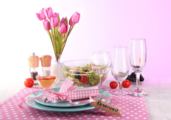 Table setting on pink background