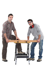 Carpenters working at a bench