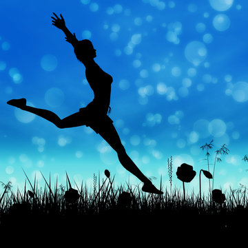 Silhouette of a girl jumping on the meadow