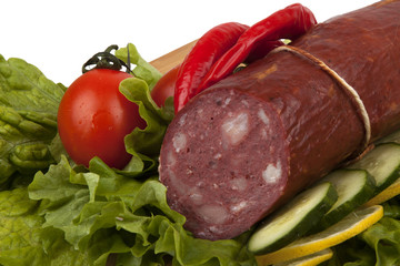 Sausage with vegetables on board