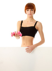 A woman with dumbbells in her hands on white