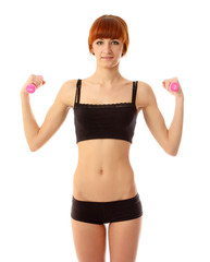 A woman with dumbbells in her hands on white