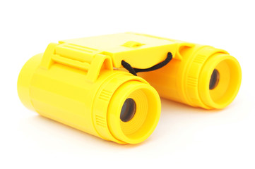 kids yellow plastic binoculars on white background