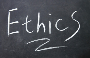 ethics title written with chalk on blackboard