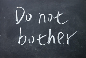 Obraz premium do not bother title written with chalk on blackboard