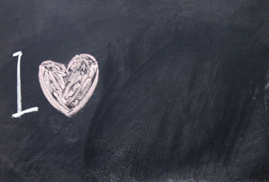 love sign drawn with chalk on blackboard