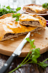 nutritious rustic meat pie in a cut