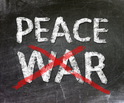 Peace and war written on a chalkboard.