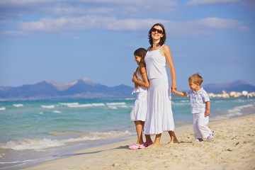 Mother with kids on beach