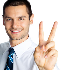 Happy businessman showing two fingers, isolated
