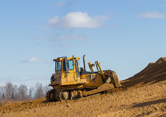 Yellow bulldozer at Work in forest