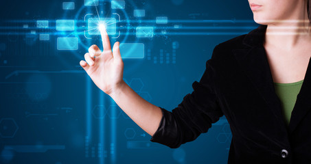 Woman pressing high tech type of modern buttons