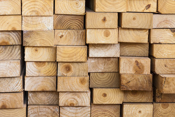 Pine wood planks stored in a sawmill for use in construction.