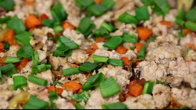 Minced meat with vegetables on a pan