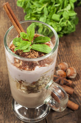 cocoa dessert with yogurt , nuts and mint