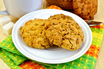 Biscuits on a wooden board with a cup