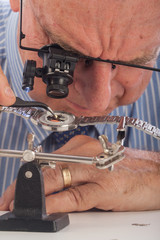 Close-Up of Man Repairing Wrist Watch