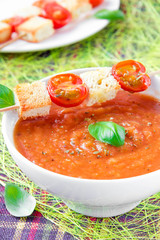 Vegetable cream soup with tomato and toast