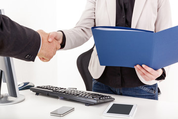 Businesswoman with briefcase man shakes the hand