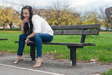 Young woman sitting on the bench