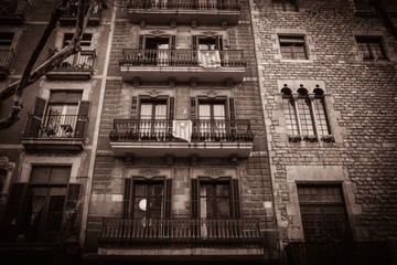 Toned picture of building facade with balconies