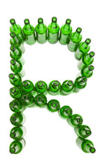The alphabet from glass beer bottles. Letter   R