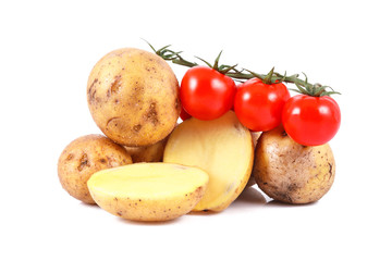 fresh potatoes and tomatoes isolated over white background