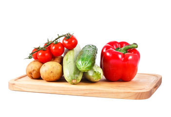 a group of fresh vegetables isolated over white background