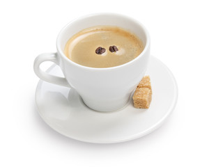 cup of espresso with cane sugar and two beans