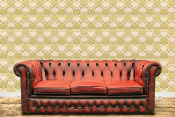 Retro styled image of an old sofa against a vintage wall