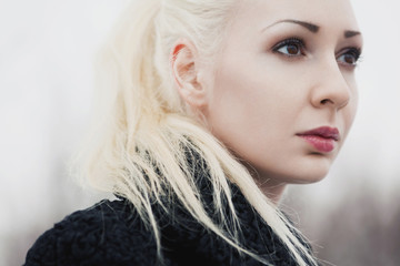 portrait of a beautiful woman in the park in early spring