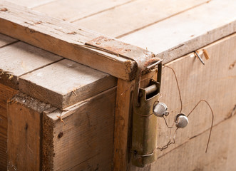 Latch with seal on wooden chest