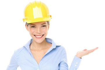 Hard hat engineer or architect woman showing