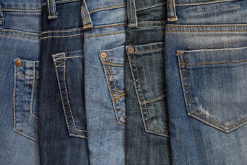It is a close up of jeans's pile.